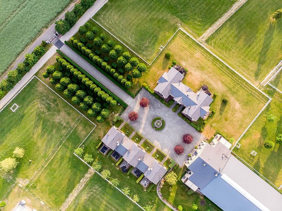 Aerial view of a green and sustainable horse property